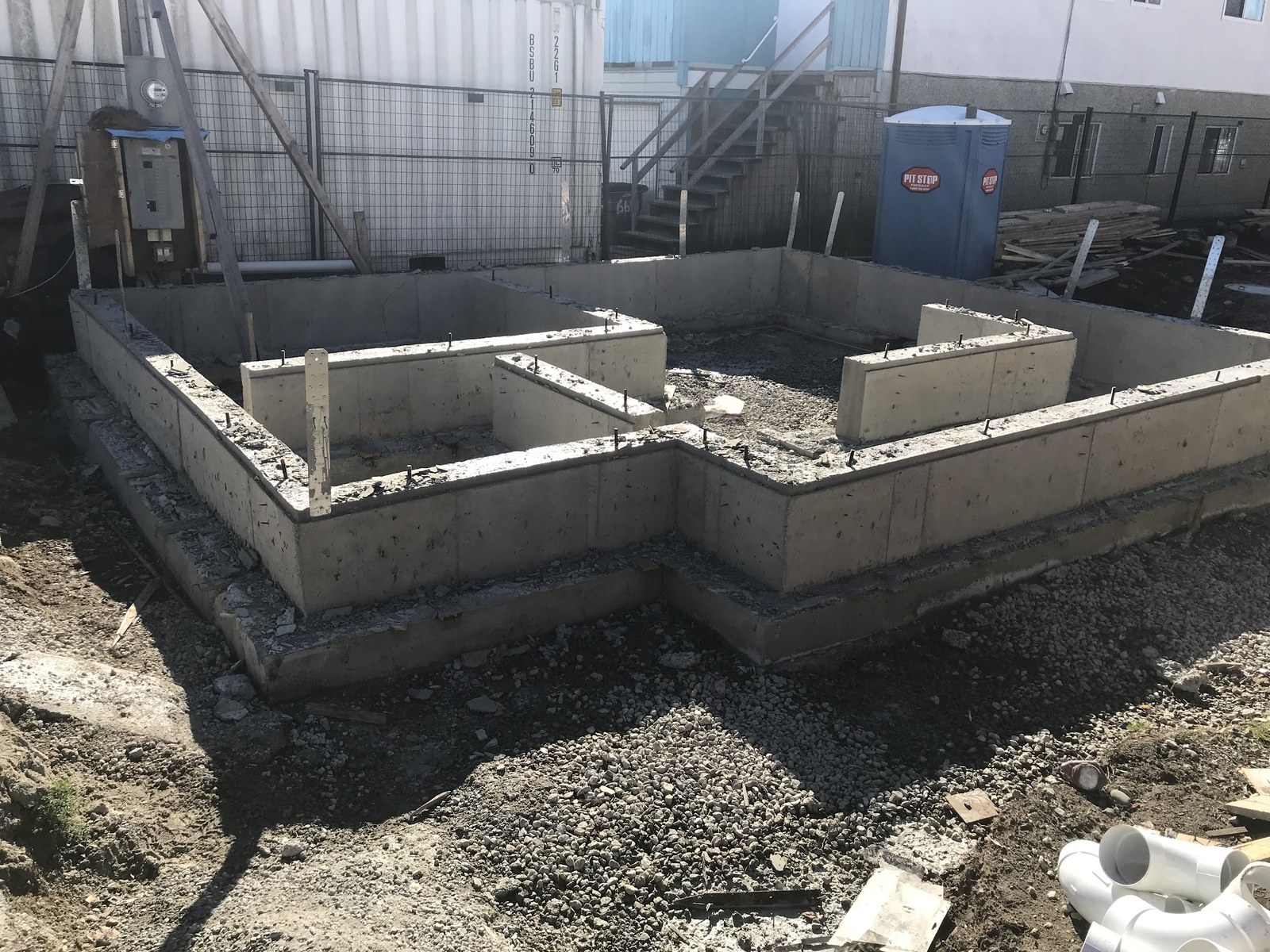 Concrete foundation walls on an AlleyLane job site