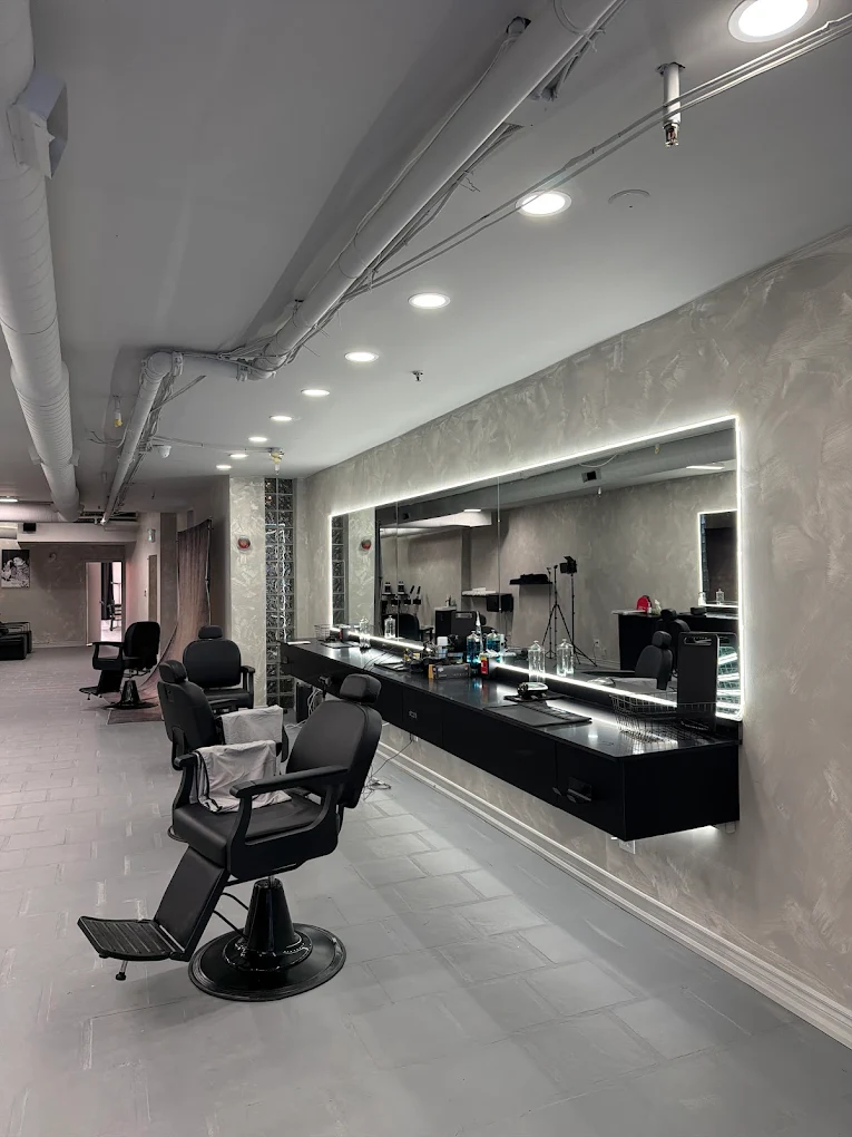 Backlit barber stations at Skyview Barbers