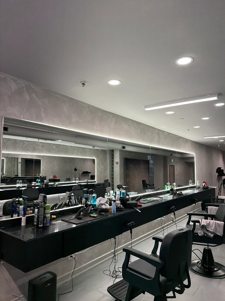Wide view of stations with backlit mirrors and stocked counters